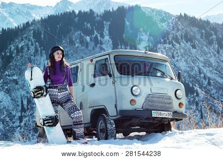 Almaty, Kazakhstan - January 10, 2019: Uaz 452 And Snowboard Burton Girl In Tian-shan Mountain On Fr