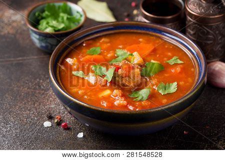 Thick Tomato Soup With Meat, Cereals And Vegetables. Traditional Oriental Cuisine, Spicy Stew With B