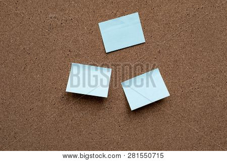 Horizontal Cork Board With Many, Sticky Notes Pinned