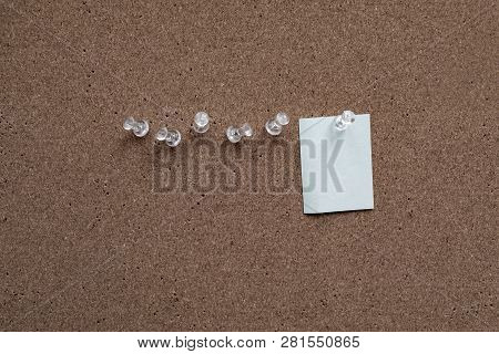 Horizontal Cork Board With Many, Sticky Notes Pinned