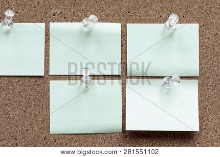 Horizontal Cork Board With Many, Sticky Notes Pinned