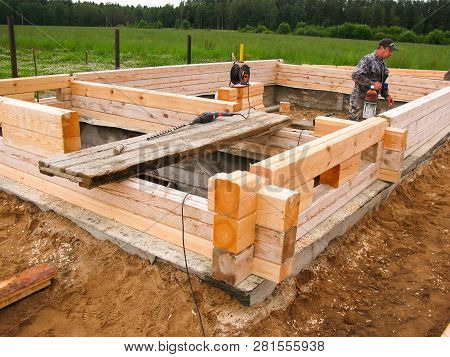 Minsk Region. Belarus. February 24, 2016. Workers Drill Holes For Driving Nagel. Construction Of Bon