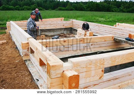 Minsk Region. Belarus. February 24, 2016. Workers Drill Holes For Driving Nagel. Construction Of Bon