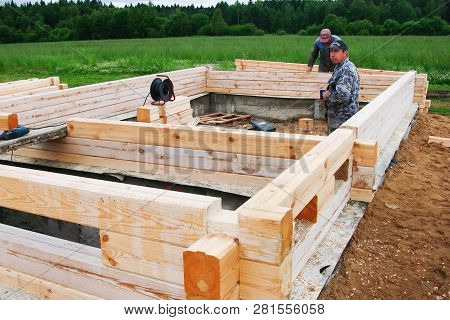 Minsk Region. Belarus. February 24, 2016. Workers Drill Holes For Driving Nagel. Construction Of Bon