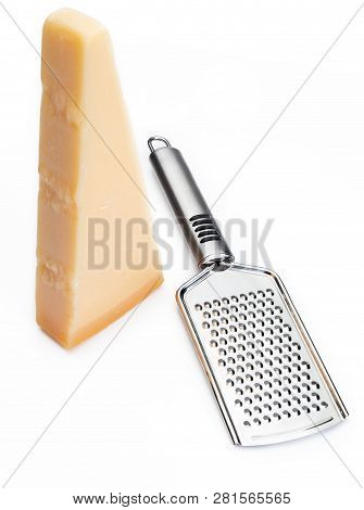 Wedge Of Parmesan Cheese Or Grana With Grater. Isolated On White Background.