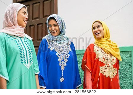 Happy Muslim Women Walking In The City - Arabian Teen Girls Having Fun Outdoor - Concept Of People, 