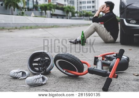 Image Of Shocked And Scared Driver After Accident Involved Kid's Bike And Helmet Lying On The Road O