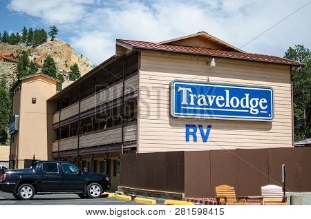 Keystone, Sd - June 20, 2018: Exterior Of A Travelodge Motel Building In The Summer, Offering Lodgin