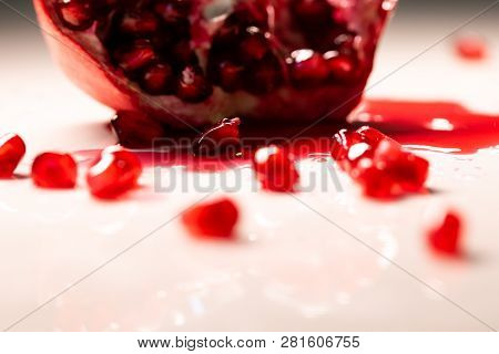 Closeup View Of Grain Red Grenades. Juicy Ripe Red Granets Or Garnets. Fruits Of Red Ripe Pomegranat