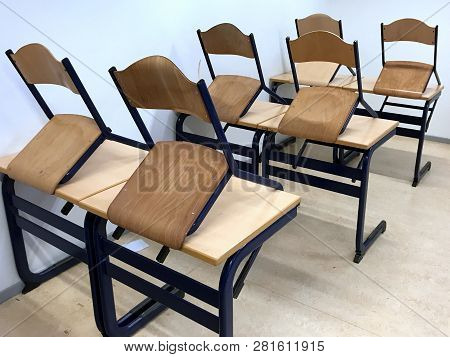 Chairs On A Table In A Empty Classroom.