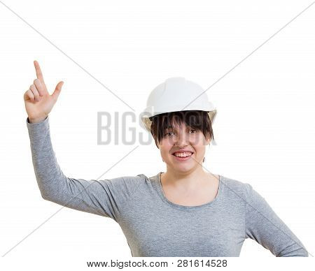 Excited Young Woman Engineer Wearing Protective Helmet Pointing Index Finger Up Looking To Camera Is