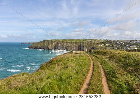 A Landscape View Of Mawgan Porth From The South West Coast Path, North Cornwall Along The Atlantic C