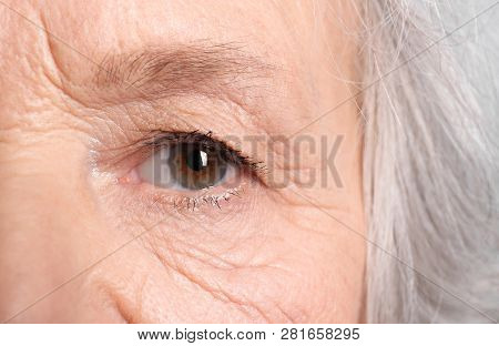 Wrinkled Face Of Elderly Woman, Closeup Of Eye