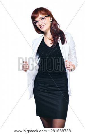 A portrait of a beautiful woman wearing classic clothes and posing over the white background in the studio. Beauty, fashion, business.