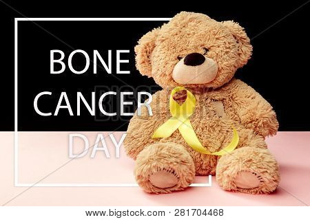 Yellow Ribbon Symbolic Color For Sarcoma Bone Cancer Awareness And Suicide Prevention With Toy Bear.