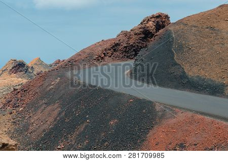 Road In Timanfaya National Park In Lanzarote,canary Islands,spain. The Spectacular Volcanic Landscap