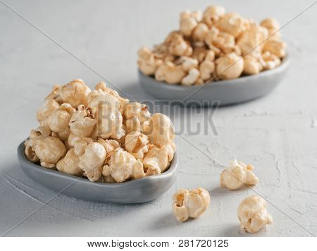 Popcorn In Gray Craft Trendy Plate On Gray Concrete Background. Moovie Background With Copy Space. T