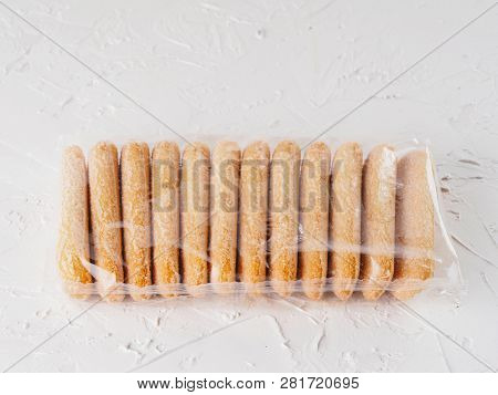 Ladyfinger Savoiardi Biscuit Cookie In Plastic Package On White Concrete Background