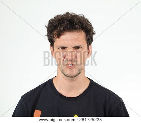 Angry Face Of Young Man Wearing Black T-shirt
