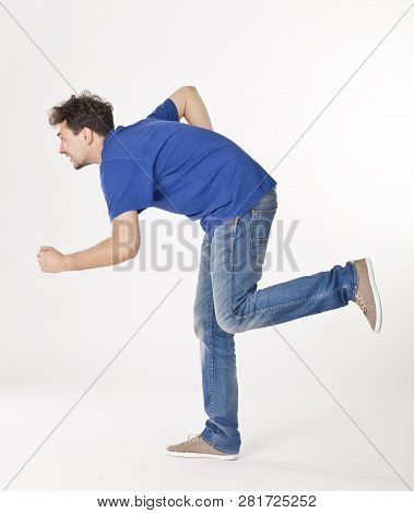Nice Guy Posing Like Running, Shooting At Studio