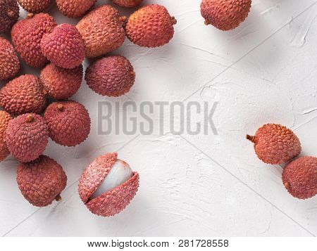Lichee Fruit On White Textured Background. Lichee Wit Copy Space. Top View Or Flat Lay.