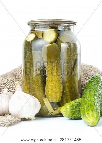Pickled Cucumbers Isolated. Pickles In Glass Jar And Garlic Isolated On White Background. Salted Cuc