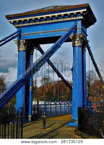 A View Of A Decorative Suspension Bridge Leading Into Glasgow Green