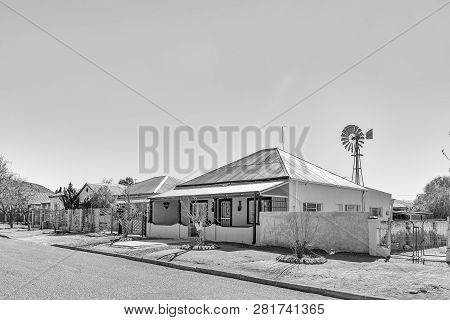 De Aar, South Africa, August 6, 2018: A Monochrome Street Scene, With Old Houses, In De Aar In The N