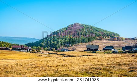 Bukovec Mountain Above Jizerka Village In Jizera Mountains, Czech Republic. Clear Sunny Day