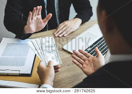 Anti Bribery And Corruption Concept, Business Man Refusing And Don't Receive Money Banknote Offered 