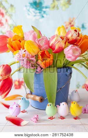 Colorful Spring Flowers In A Little Vintage Bucket