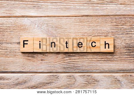 Fintech Word Written On Wood Block. Fintech Text On Wooden Table For Your Desing, Concept