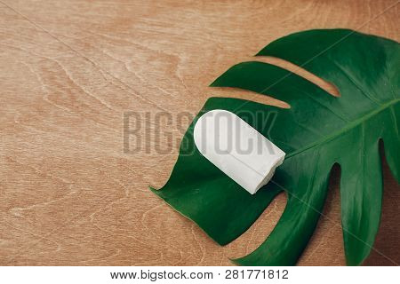 Natural Eco Crystal Deodorant Anulit On Wooden Background With Green Monstera Leaf. Plastic Free Bea