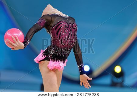 KIEV, UKRAINE - AUGUST 28, 2013: Lucille Chalopin, France performs with ball during 32nd Rhythmic Gymnastics World Championships. The event is held in Palace of Sport