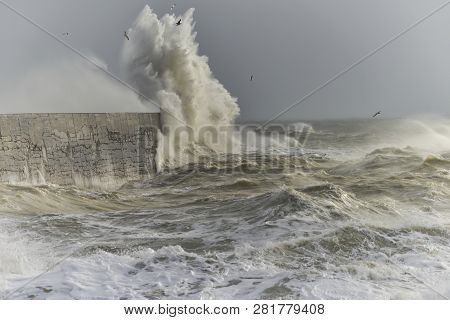 Stunning Waves Crashing Over Harbor Wall During Windy Storm At Newhaven On English Coast