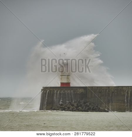 Stunning Waves Crashing Over Harbor Wall During Windy Storm At Newhaven On English Coast