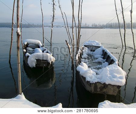 Snow And Ice Covered Boats In The Winter Freezing Day. River Danube Environment, Futog Serbia