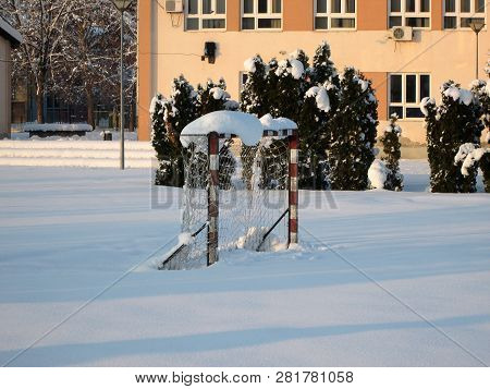 Snow And Ice Covered Football Court In The Winter Freezing Day. River Danube Environment, Futog Serb