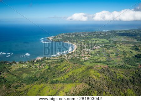 Aerial View Of Hanalei Bay And Princeville On Hawaiian Island Of Kauai From Helicopter Flight