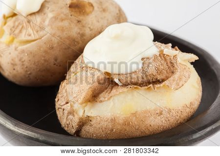 Traditional Colombian Cooked Potatoes Called Papas Saladas Topped With Mayonnaise Isolated On White