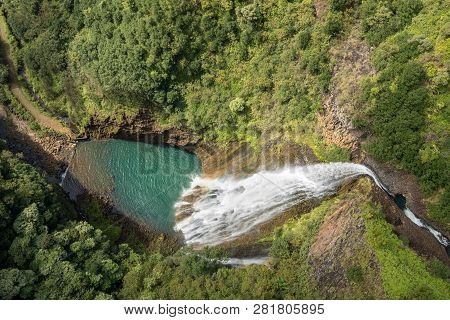 Aerial View Of Manawaiopuna Falls And Landscape Of Hawaiian Island Of Kauai From Helicopter Flight