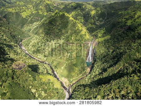 Aerial View Of Manawaiopuna Falls And Landscape Of Hawaiian Island Of Kauai From Helicopter Flight