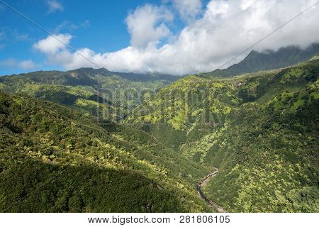 Aerial View Of Manawaiopuna Falls And Landscape Of Hawaiian Island Of Kauai From Helicopter Flight