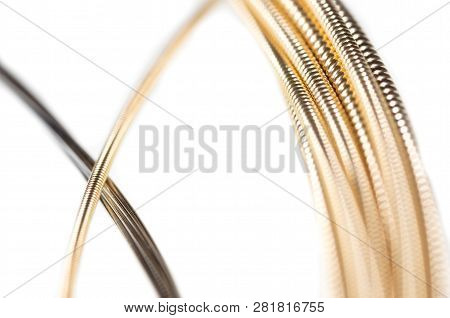 Strings For Guitar Isolated On A White Background. Macro