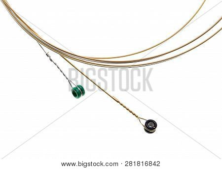 Strings For Guitar Isolated On A White Background. Macro