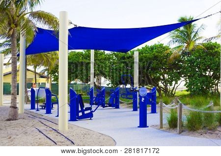 Public Beach Area With An Outdoor Gym That Has Workout Machines. Plublic Are Of A Beach With Workout