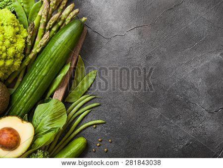 Assorted Green Toned Raw Organic Vegetables On Dark Background. Avocado, Cabbage, Broccoli, Cauliflo