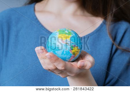 Young Unrecognizable Woman Holding World Globe In Her Hands - Travel Or Environmnetal Protection Con