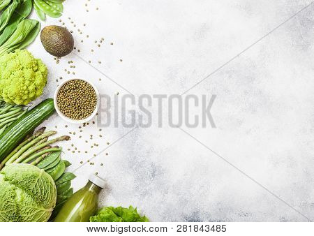 Assorted Green Toned Raw Organic Vegetables On White Background. Avocado, Cabbage, Broccoli, Caulifl
