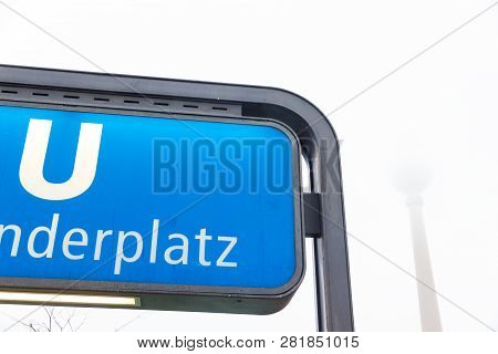 Berlin, Germany - December 21, 2017. Alexanderplatz Subway Station Sign In Winter In A Foggy Day